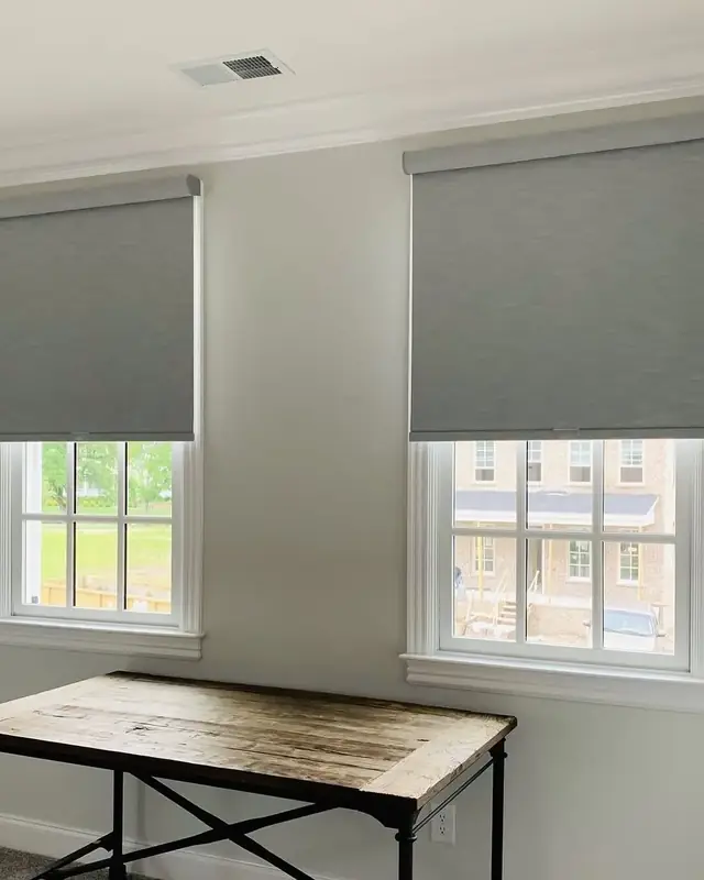 Grey roller blinds in an office, Capital Governorate